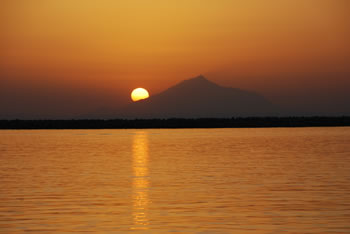 Sun sets behind Mount Athos