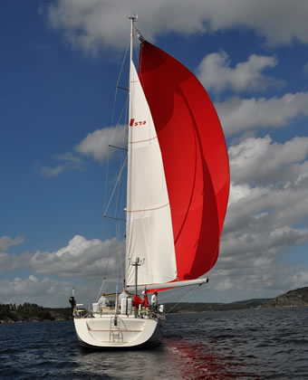 using the asymmetric spinnaker as part of your downwind sailing plan for ocean and coastal cruising.